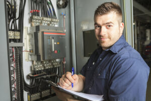 Portrait of an happy worker in a factory