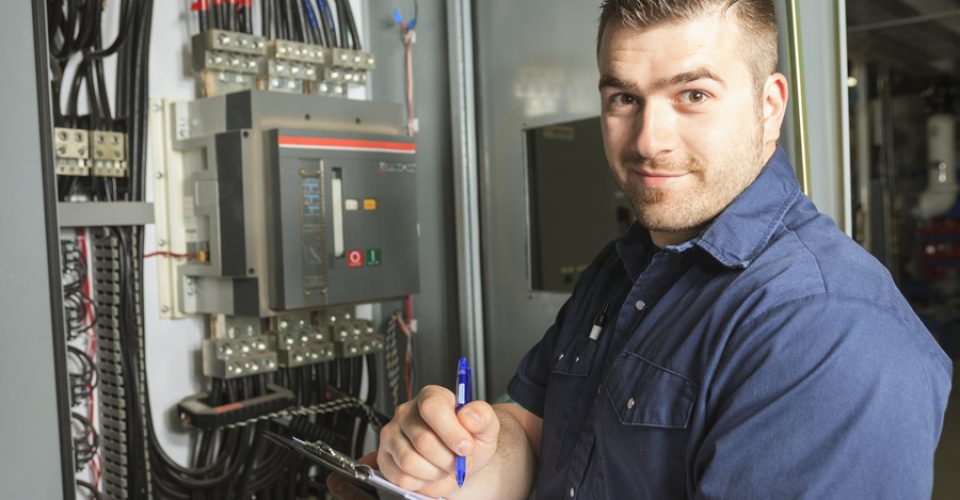 Portrait of an happy worker in a factory